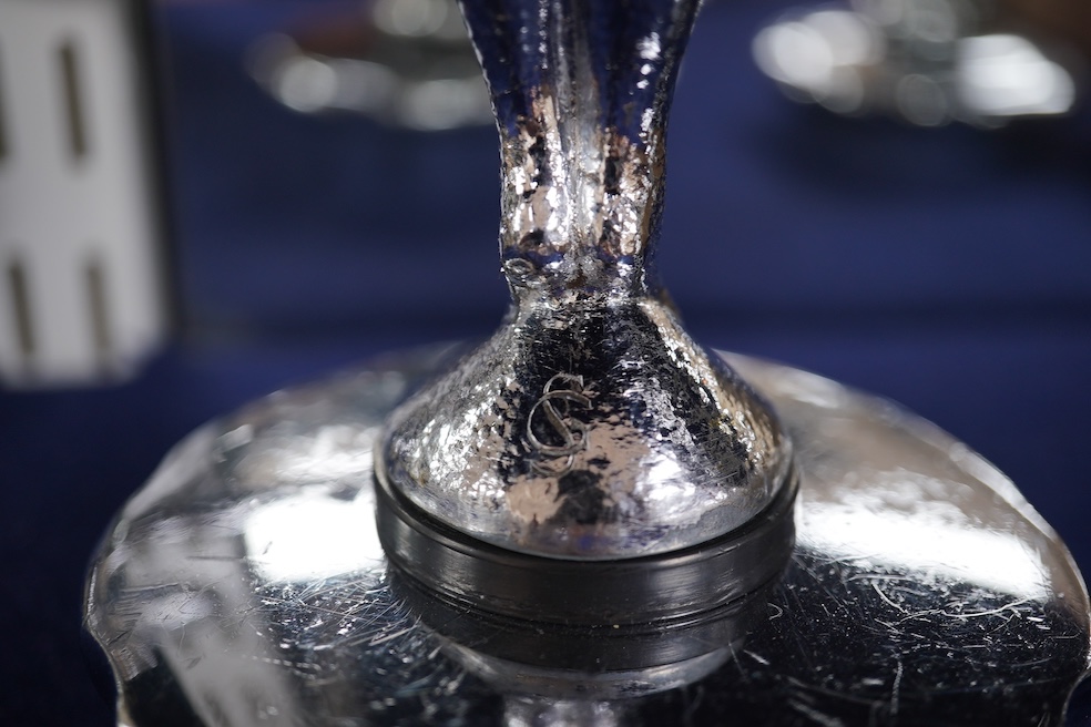Five chrome car mascots in the form of female dancing figures, three mounted on threaded radiator caps, one with a registration number: 675619, one a stylised Art Deco winged female figure astride a globe. Condition - fa